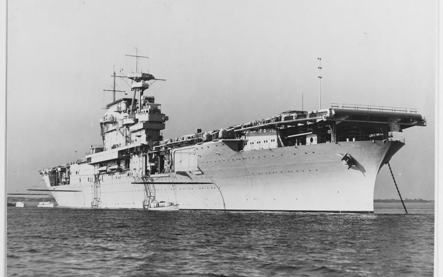 A black and white photo of the World War II aircraft carrier.