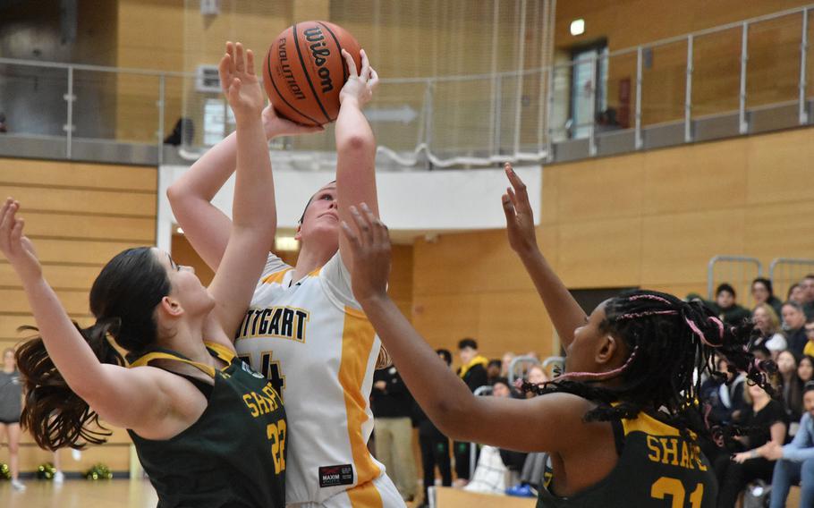Stuttgart’s Ella Kirk got the offensive rebound and then went up for a shot Friday, Feb. 16, 2024, at the DODEA European Basketball Championships in Wiesbaden, Germany.