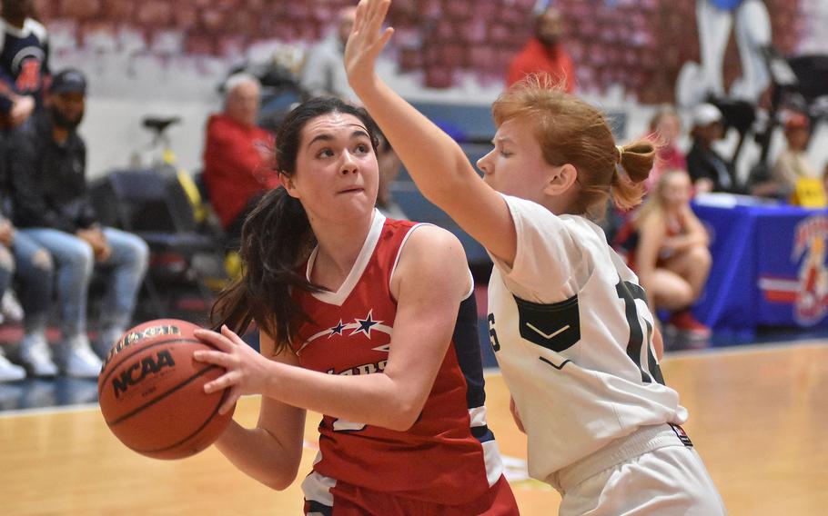 Naples' Emma Kennicott puts pressure on Aviano's Grace O'Connor in the Wildcats' 35-20 victory over the Saints on Saturday, Jan. 7, 2023.