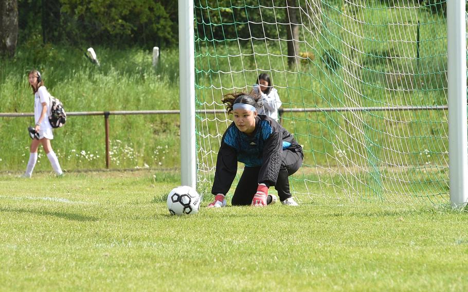 Vicenza goalkeeper Gia Barea watches the ball after making a save during the penalty shootout against Black Forest Academy during a Division II semifinal of the DODEA European soccer championships on May 17, 2023, at VfR Baumholder's stadium in Baumholder, Germany.