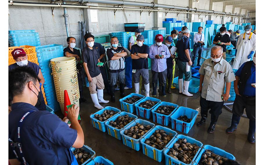 Buyers gather for an auction at Numanouchi fish port in Iwaki, Fukushima Prefecture, on Aug. 24, 2023.