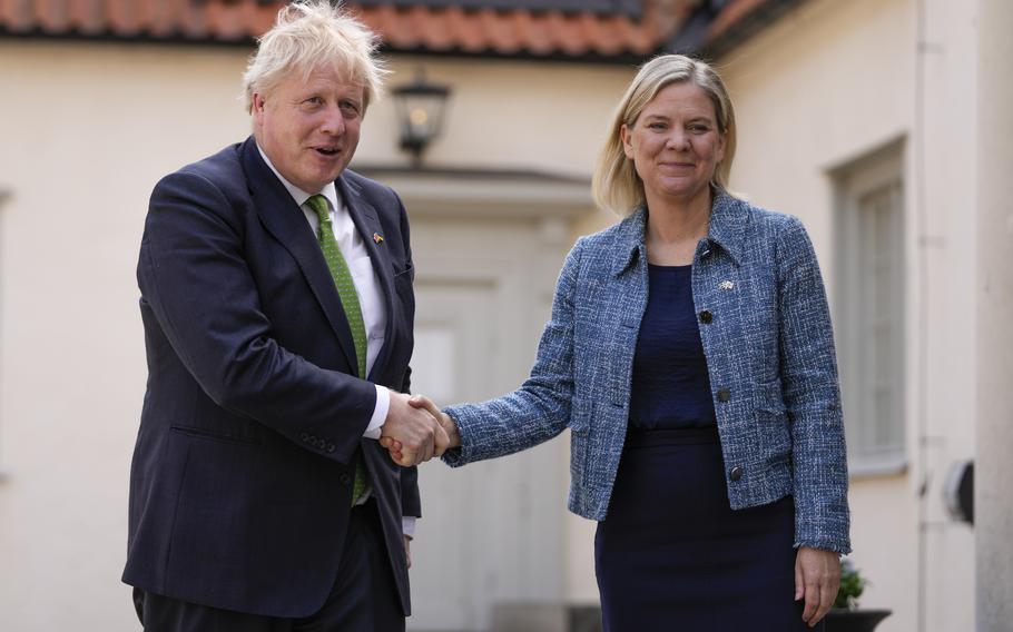 British Prime Minister Boris Johnson, left, is welcomed by Sweden’s Prime Minister Magdalena Andersson in Harpsund, the country retreat of Swedish prime ministers, Wednesday, May 11, 2022. Johnson is visiting Sweden and Finland ahead of their decision on whether to apply for NATO membership.