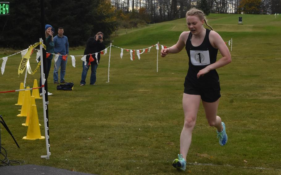 Stuttgart’s Ella Bishop crosses the finish line first at the DODEA-Europe cross country championships on Saturday, Oct. 23, 2021, in Baumholder, Germany. Bishop won the girls large-school division race in 20:31.88.