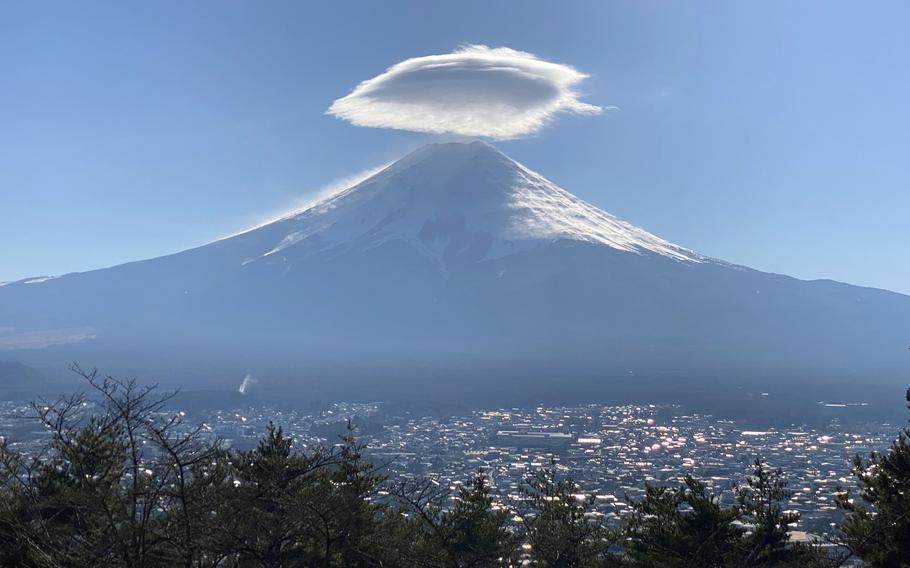 Mount Fuji and the city of Fujiyoshida are pictured on Dec. 12, 2021. 