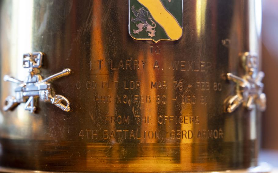 A commemorative shell given to Larry Wexler sits on display at at his residence in Virginia Beach, Va., on Dec. 8, 2022.