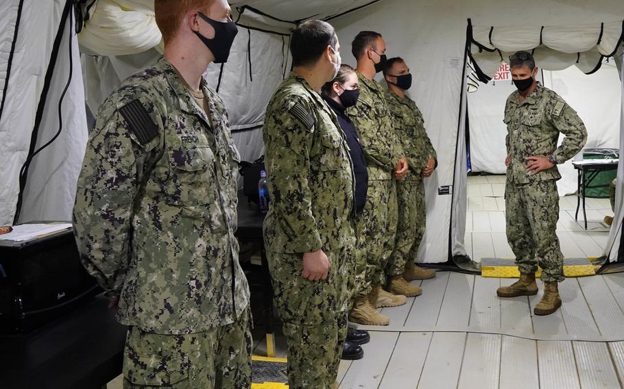 Vice Adm. Andrew Lewis, Commander, U.S. 2nd Fleet, speaks with a group of sailors he intends to present a challenge coin to during a visit to the U.S. 2nd Fleet’s Expeditionary Maritime Operations Center (ExMOC) Joint Expeditionary Base Little Creek-Fort Story on Aug. 11, in support of Large-Scale Exercise (LSE) 2021.