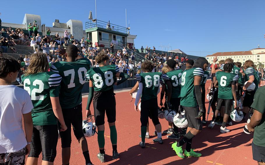 The Naples Wildcats stand before the crowd after winning Saturday's DODEA European Division II championship game.