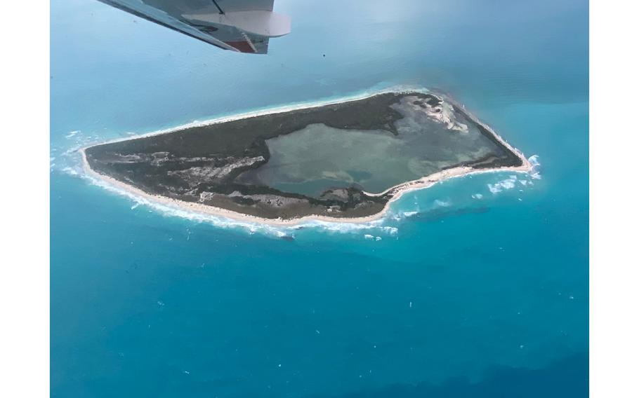 A U.S. Coast Guard C-144 Ocean Sentry circles above Cay Sal Bank in the Bahamas on Jan. 14, 2023. 