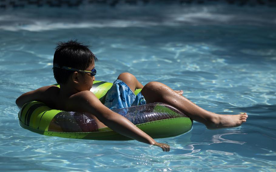 Taylor Qiu, 11, lounges on a pool float. The average price to rent a pool on Swimply is $45 an hour. Taylor’s family rented the pool for $140 for two hours, split with another family. 