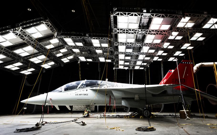 A  T-7A Red Hawk sits under bright lights used to create heat in the McKinley Climatic Lab at Eglin Air Force Base, Fla.