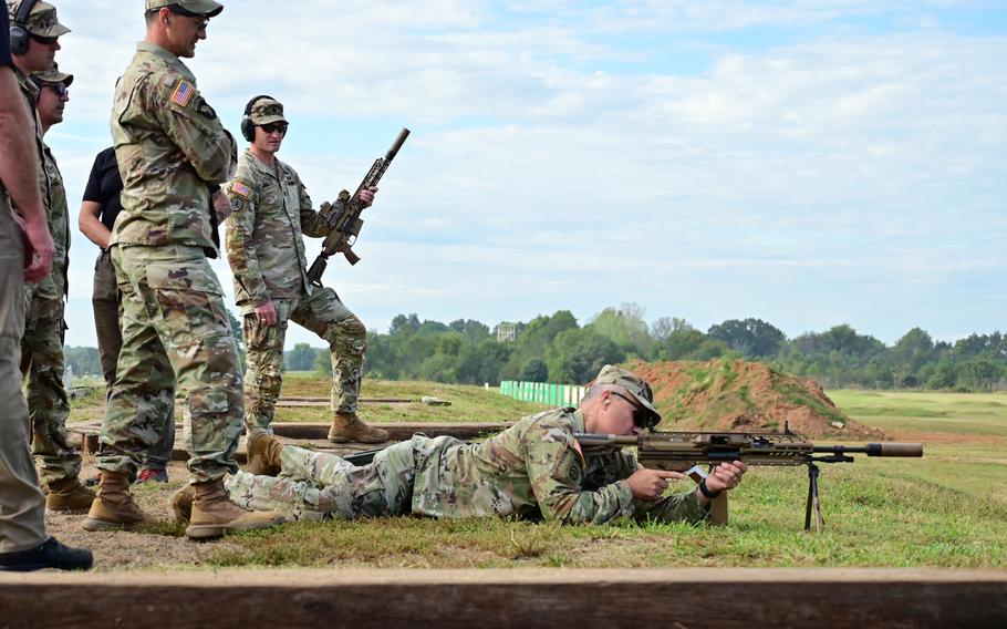 Army Col. Christopher Midberry, Fort Campbell garrison commander, fires a Next Generation Squad Weapon during a demonstration on Sept. 25, 2023, at Fort Campbell, Ky. The XM7 rifle and the XM250 automatic rifle are primed to replace the M4 carbine and M249 squad automatic weapon.