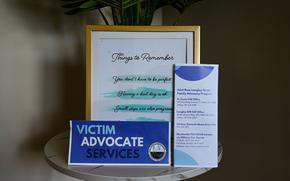 An informational table with different resources for domestic violence survivors is displayed in the Sexual Assault and Prevention office at Joint Base Langley-Eustis, Virginia, Dec. 1, 2022. The JBLE SAPR Program actively commits to the safety and well-being of all Airmen and their families, through safety planning, advocacy and crisis support for victims of domestic/intimate partner abuse. (U.S. Air Force photo by Senior Airman Chloe Shanes)