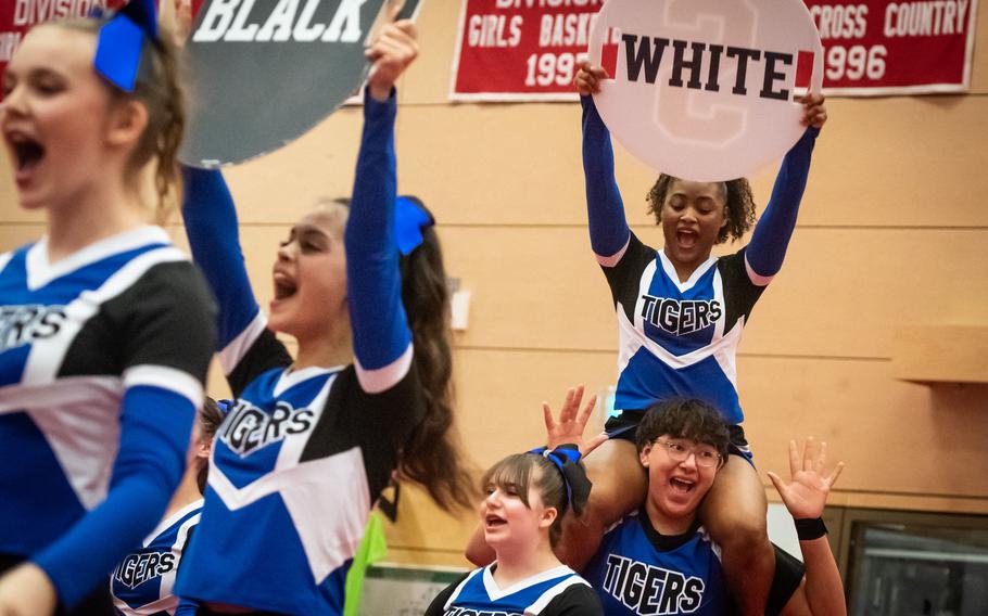 Iy’sis Greene is carried on Brian David’s shoulders as the Hohenfels High School cheer team competes in the 2023 DODEA-Europe Cheerleading Championships at Kaiserslautern High School on Friday, Feb. 18.