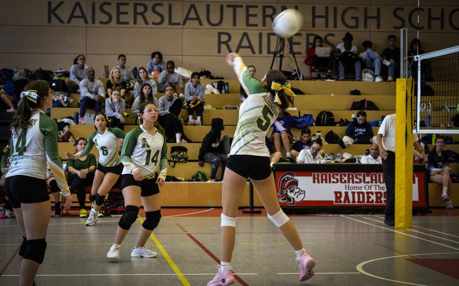 Alconbury Dragon Sofia Politis digs the ball over the net against the Spangdahlem Sentinels while fellow Dragon Lana Reyes observes the play during the DODEA Division III European volleyball fifth-place game on Oct. 27, 2023, in Kaiserslautern, Germany.