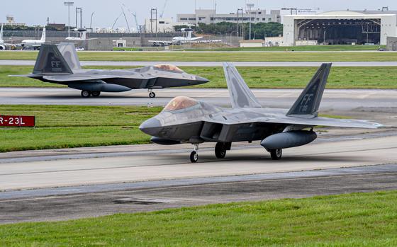 F-22A Raptors taxi away from the runway at Kadena Air Base, Okinawa, April 20, 2024.