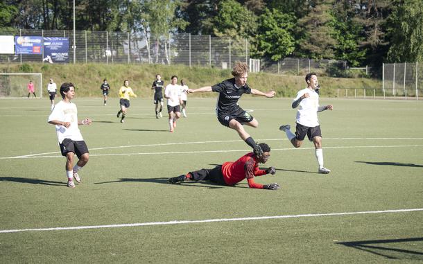 Keiran Daley, a sophomore with the Alconbury Dragons, takes a shot on goal against the Spangdahlem Sentinels in the 2025 DODEA European Division III Championships in Landstuhl, Germany on May 19, 2025. The Dragons won the match against the Sentinels 4-0.