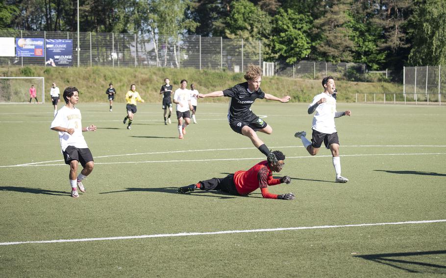 Keiran Daley, a junior with the Alconbury Dragons, takes a shot on goal against the Spangdahlem Sentinels in the 2025 DODEA European Division III Championships in Landstuhl, Germany on May 19, 2025. The Dragons won the match against the Sentinels 4-0.