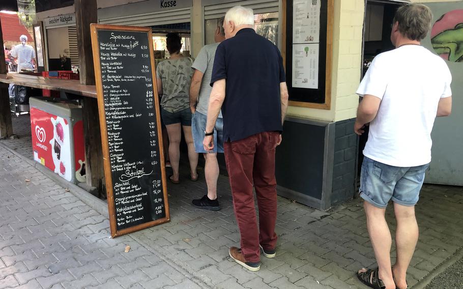 In traditional beer garden style, customers at the Biergarten in Darmstadt, Germany, order at the counter. They take their drinks with them and pick up their food after a pager signals that the order is ready.