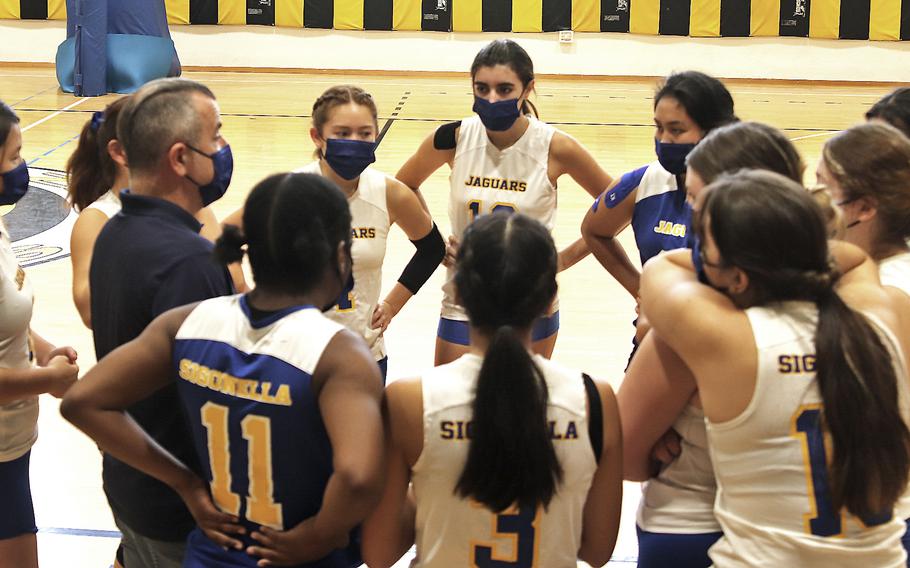 Shawn McCarthy, the Sigonella girls volleyball coach, talks to his team during a time out Saturday in a match between Vicenza and the Jaguars. Vicenza won the match in straight games, 25-12, 25-12, 25-10. 