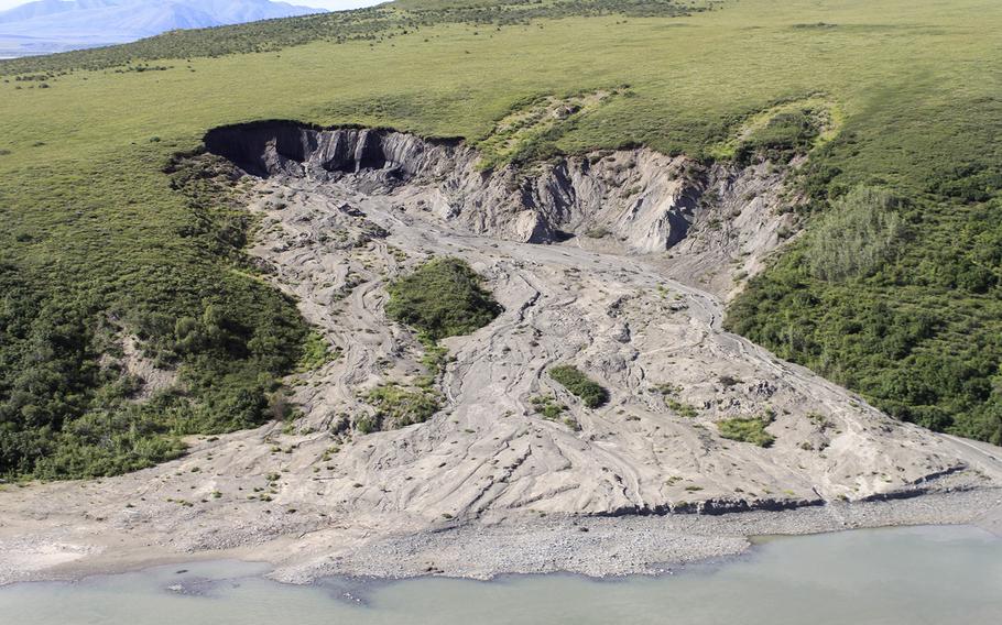 A hillside “slump” in the Noatak National Preserve in Alaska in 2004. Scientists say Arctic slumps triggered by a warming climate release carbon previously trapped under ice.