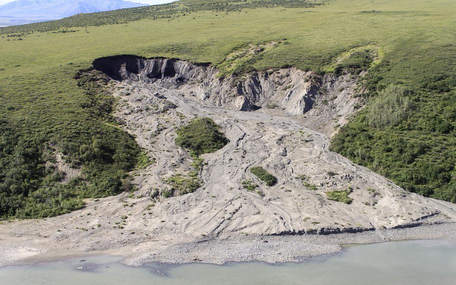 A hillside “slump” in the Noatak National Preserve in Alaska in 2004. Scientists say Arctic slumps triggered by a warming climate release carbon previously trapped under ice. 