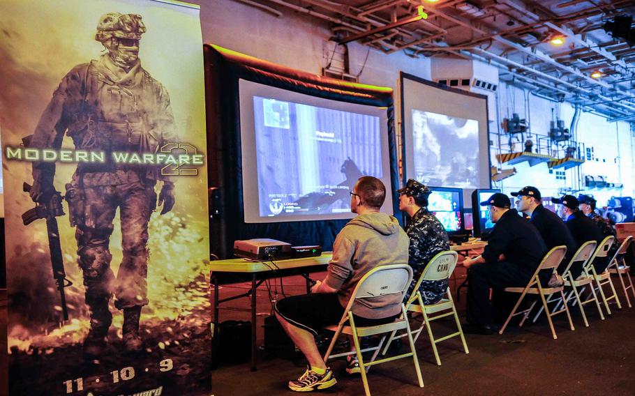 Sailors play Call of Duty aboard the USS John C. Stennis, March 15, 2010, in San Diego, Calif. The popular series is slated to put out a board game next year, according to Activision.