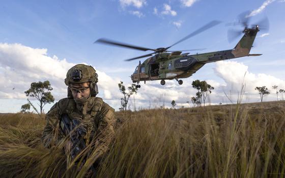 In this photo provided by the Australian Defense Force, soldiers from the 4th Regiment, Royal Australian Artillery and 3rd Battalion dismount from an MRH-90 Taipan during Exercise Chau Pha at Townsville Field Training Area, Townsville, Queensland, on June 12, 2023. The Australian army will never again fly its fleet of MRH-90 Taipan helicopters following a crash in July that killed four personnel, the defense minister said on Friday, Sept. 29, 2023.