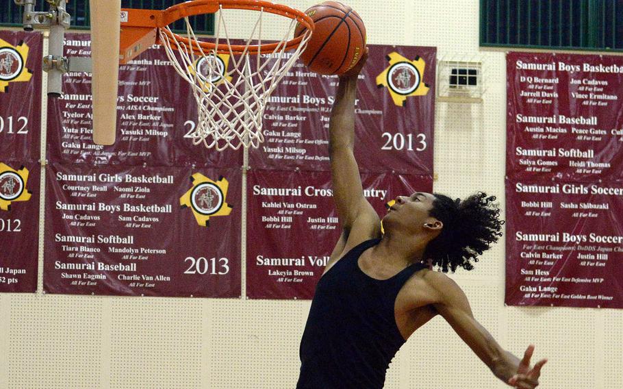 6-foot-3 senior Shion Fleming is one of a handful of football players on Matthew C. Perry's boys basketball roster.