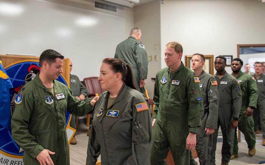Members of the 170th Air Refueling Wing receive their newly designed squadron patch from Lt. Col. Matthew Secko, 170th Air Refueling Squadron commander, during the 170th assumption of command ceremony Thursday, March 7, 2024, at Joint Base McGuire-Dix-Lakehurst, N.J.