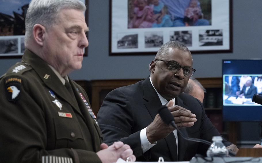 Defense Secretary Lloyd Austin, accompanied by Army Gen. Mark Milley, chairman of the Joint Chiefs of Staff, testifies Wednesday, May 11, 2022, before the House Committee on Appropriations subcommittee on defense during a hearing on Capitol Hill in Washington.