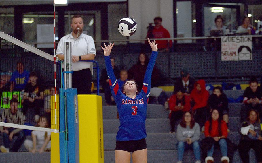 Ramstein's Jazmyn Hall sets the ball in a match against Wiesbaden during pool-play action of the DODEA European volleyball championships on Oct. 26, 2023, at Southside Fitness Center on Ramstein Air Base, Germany.