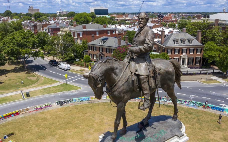 The statue of Confederate Gen. Robert E. Lee stands on Monument Avenue in Richmond, Va., on July 10, 2020. The Supreme Court of Virginia is set to hear arguments Tuesday, June 8, 2021, in legal challenges to Virginia Gov. Ralph Northam's plan to take down the 131-year-old statue.