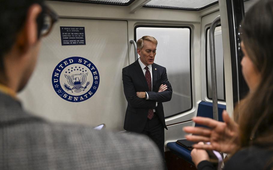 Sen. James Lankford (R-Okla.) talks to reporters following a vote on the national security package Feb. 7, 2024, in Washington.