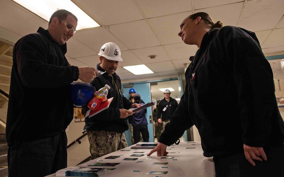 Sailors assigned to the aircraft carrier USS John C. Stennis talk about the sexual assault prevention and response program and its resources in Newport News, Va., on April 4, 2022. The Navy recently announced two administrative changes to its sexual assault program.