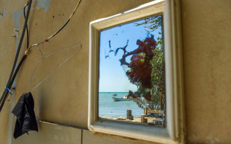 boats are reflected in a mirror.