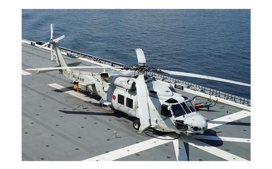 An SH-60K anti-submarine helicopter sits on the flight deck of Japan's Maritime Self Defense Force helicopter carrier JS Izumo (DDH-183) off the coast of Brunei on June 26, 2019. Late Saturday, April 20, 2024, contact was lost with two Japanese navy SH-60K choppers carrying eight crewmembers, believed to have crashed in the Pacific Ocean south of Tokyo during a night-time training exercise, and rescuers were searching for the missing, Japan’s defense minister said. 