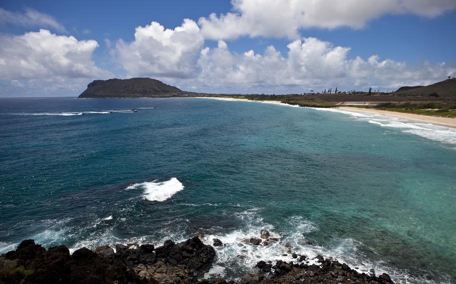 Assault amphibious vehicles head toward the shore at Marine Corps Base Hawaii, July 14, 2016. 