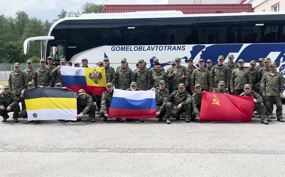 Belarusian, Russian, and Chinese service members pose for a photo after being captured by Ukraine.