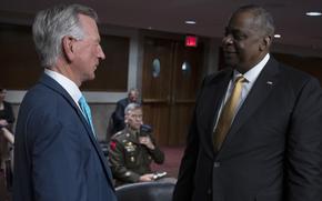 Sen. Tommy Tuberville, R-Ala., left, speaks with Defense Secretary Lloyd Austin in June 2021. This year, Tuberville has blocked hundreds of military nominations and promotions because of abortion policies that Austin approved. But a  legal review by the Government Accountability Office published Sept. 26, 2023, said the Defense Department did not need approval from Congress to implement the trio of rules.
