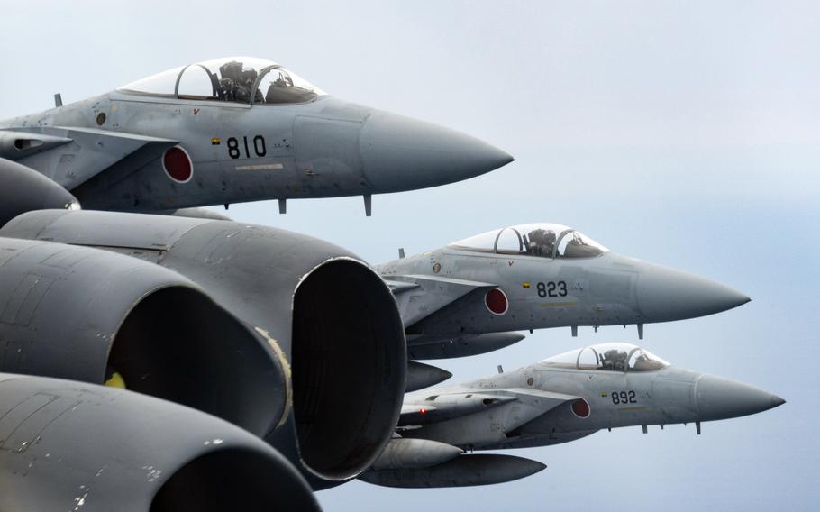Japan Air Self-Defense Force F-15 Eagle fighters escort a pair of B-52H Stratofortress bombers somewhere in  in the Indo-Pacific region, Sept. 21, 2021. 