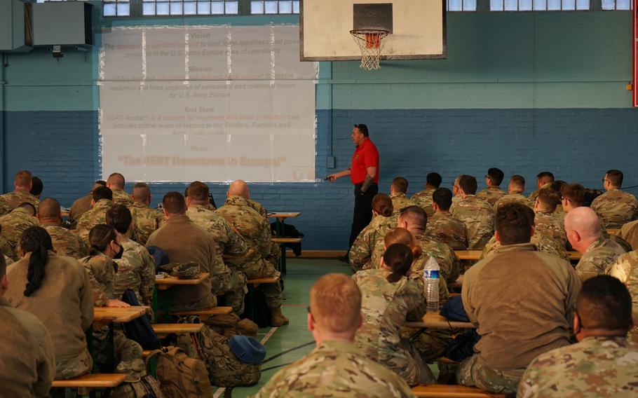 Rob Goodenow of U.S. Army Garrison Ansbach talks with soldiers during inprocessing on Barton Barracks, Ansbach, Germany, March 8, 2022.