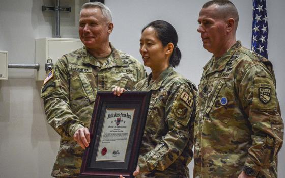 Good Neighbor Award winner Air Force Staff Sgt. Ellen Lim, center, of Osan Air Base, South Korea, logged more than 180 community service hours in 2023.