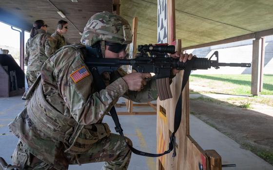 A man uses a rifle to shoot at a gun range in Georgia.