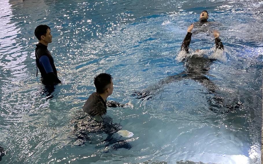 Cadets from the Korean Military Academy take part in water survival training at Camp Humphreys, South Korea, Feb. 15, 2022.