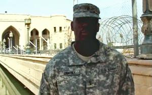In this screenshot from a Defense Department video, then-1st Lt. Carz Craffey sends Thanksgiving greetings from Baghdad in 2009. Also known as Caz Craffy, the Army Reserve major and financial counselor has been indicted on charges stemming from a scheme that defrauded grieving military families out of $3 million in survivor benefits, according to the Justice Department.