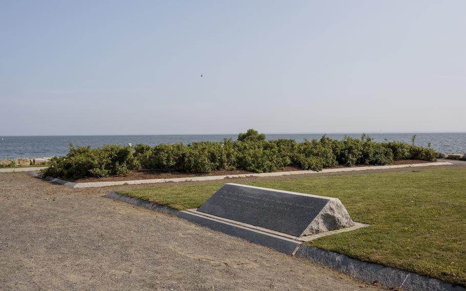 A stone commemorates Jack's father, James Matthew Patrick, at a 9/11 memorial in Connecticut. 