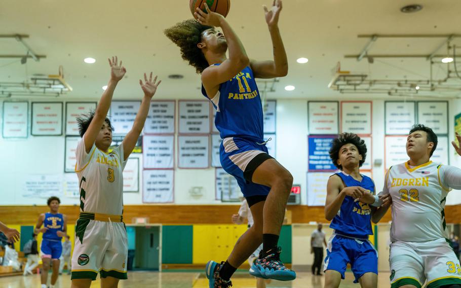 Yokota's Damian Abrams skies for a shot against Robert D. Edgren during Friday's DODEA-Japan boys basketball game. The Panthers won 71-31.