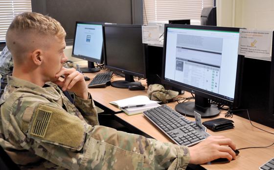 Spc. Jared Wickert, with the 1st Stryker Brigade Combat Team, 4th Infantry Division, reviews website information during an Army Credentialing Assistance Program briefing at Fort Carson, Colo., Nov. 13, 2019. 