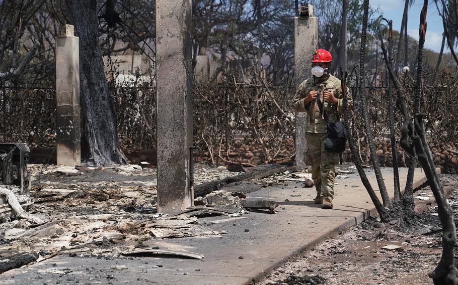 A National Guard troop assists in search and recovery efforts in Lahaina, Maui, Hawaii, on Aug. 10, 2023. 