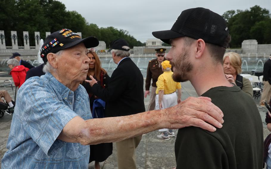 World War II veteran Les Jones speaks with Jacob Sypolt of Preston County, W.Va., at the World War II Memorial on the National Mall in Washington, D.C., on Memorial Day, April 29, 2023. “You’re the kind of guy I put my life on the line for,” he told Sypolt.